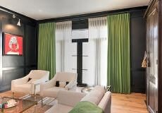 Living Room with Green Drapes